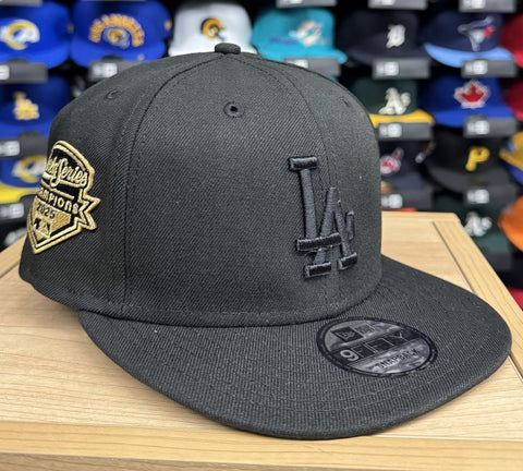 Los Angeles Dodgers Snapback New Era 2025 World Series Champions 9Fifty Adjustable Hat - Black on Black Gold